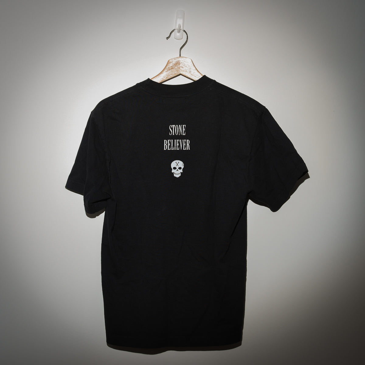 Greedy Unit Stone Believer tee back view with Stone Believer skull graphic