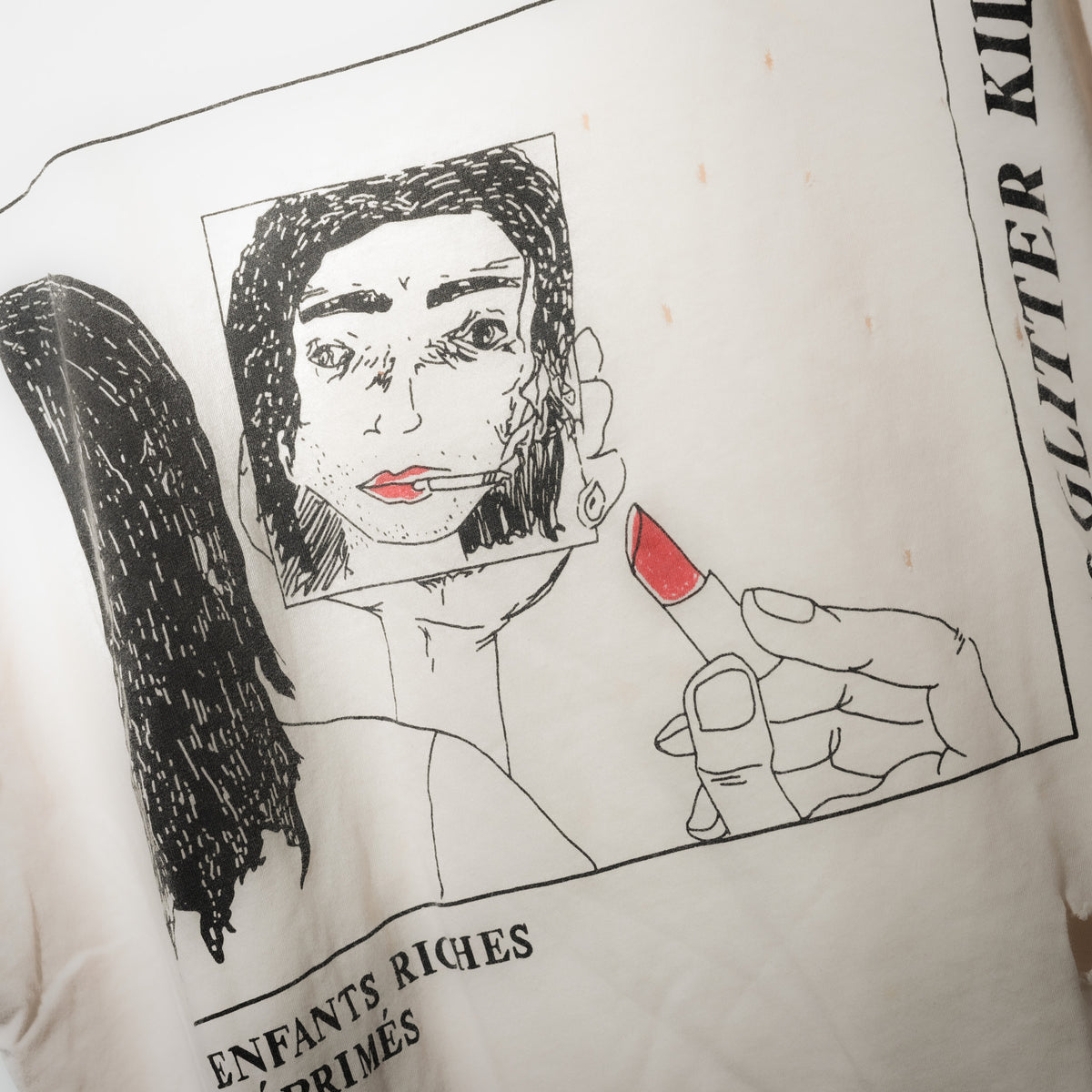Enfants Riches Déprimés lipstick tee graphic close up with red lipstick detail