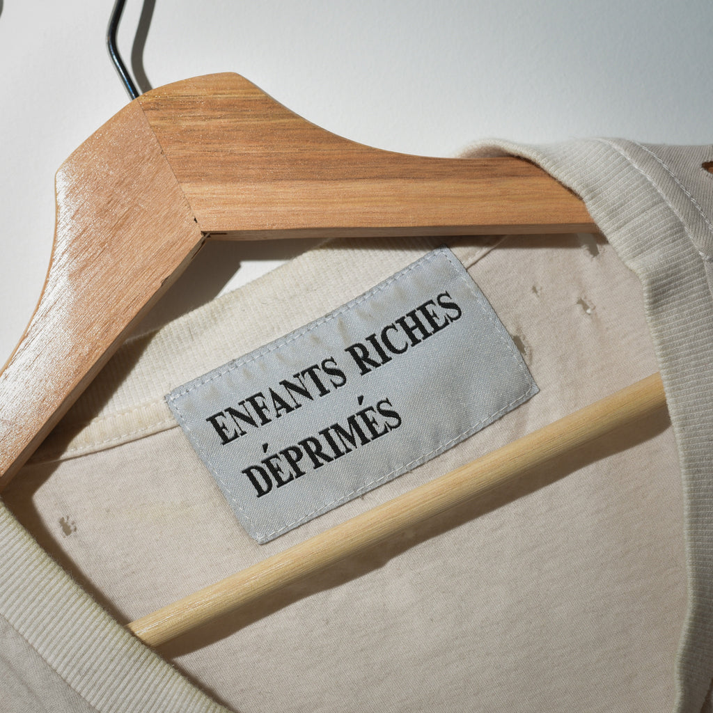 Enfants Riches Déprimés woven neck label close up