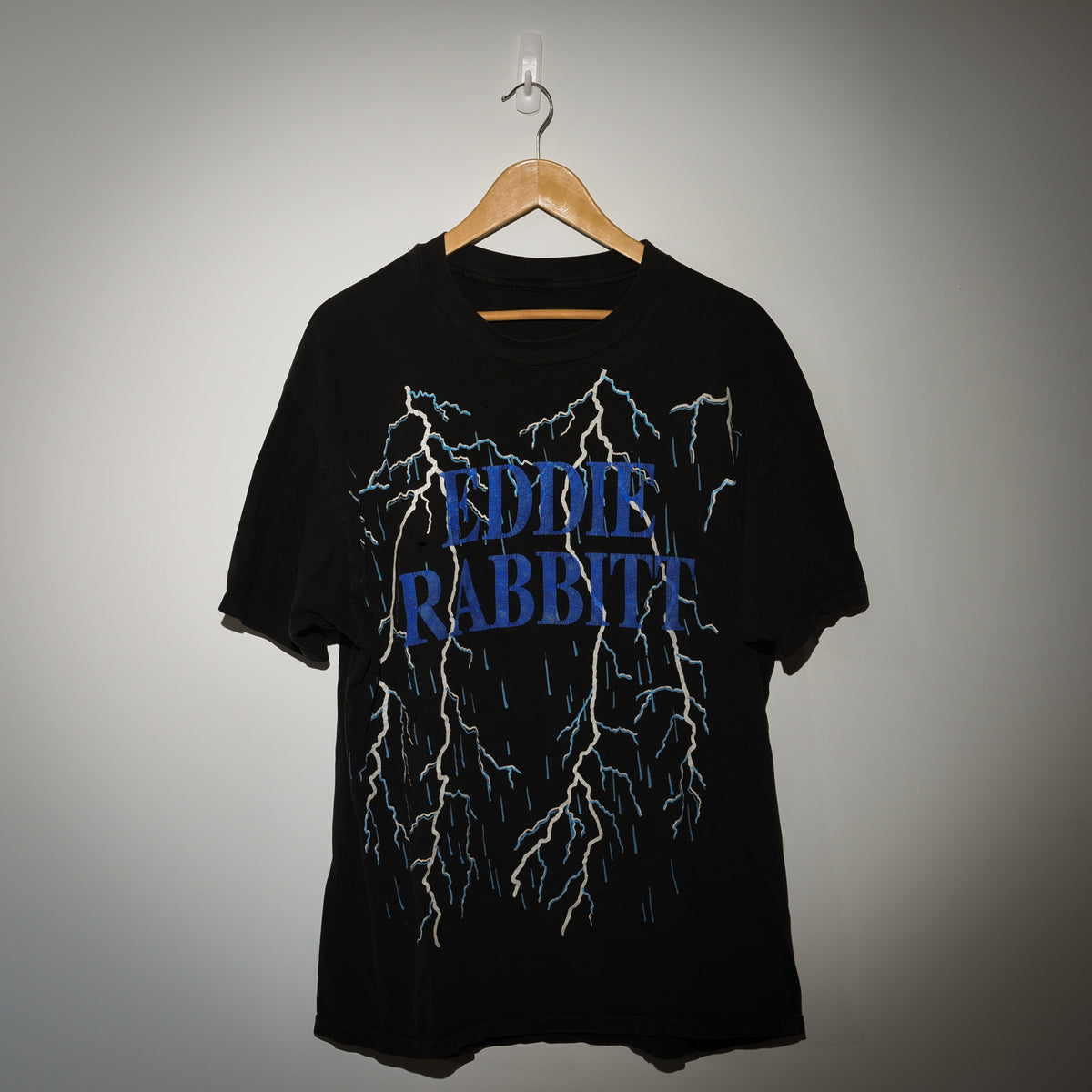 Vintage Eddie Rabbitt I Love a Rainy Night tee front view with lightning bolt graphic