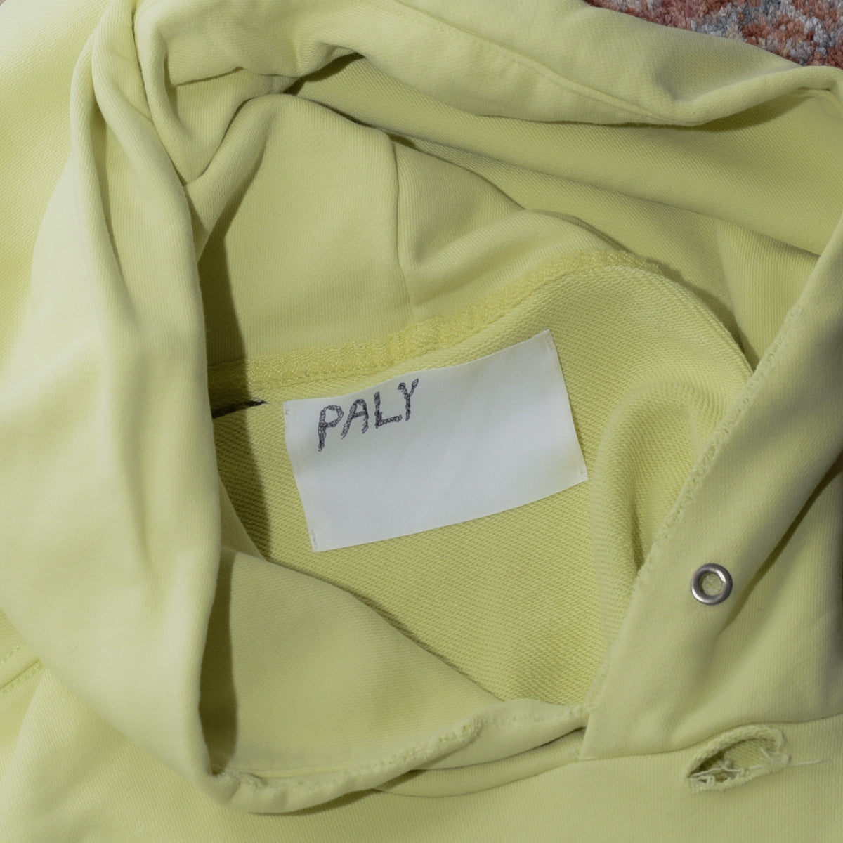 Paly Hollywood hoodie hand-written name tag label close up