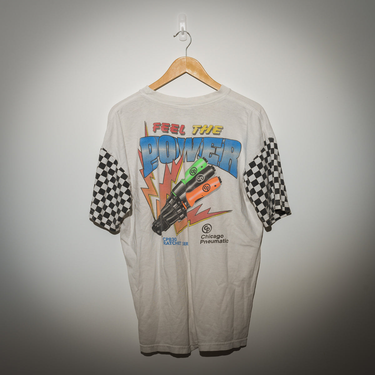 Vintage Chicago Pneumatic Feel The Power back graphic with checkerboard sleeves