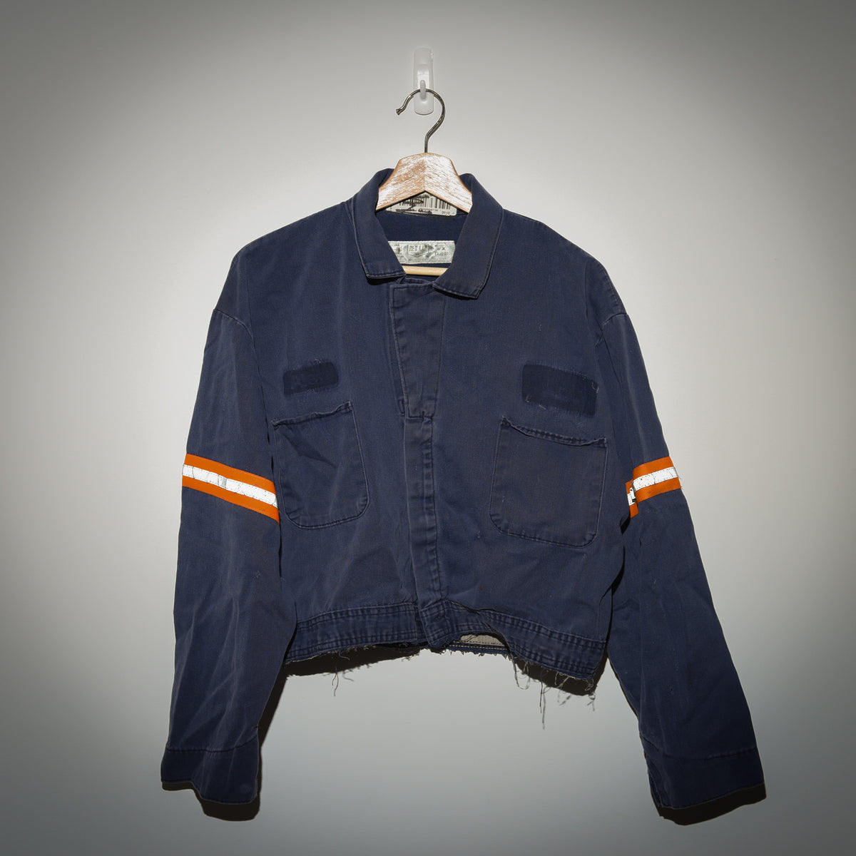 Vintage Red Kap cropped work jacket front view on hanger