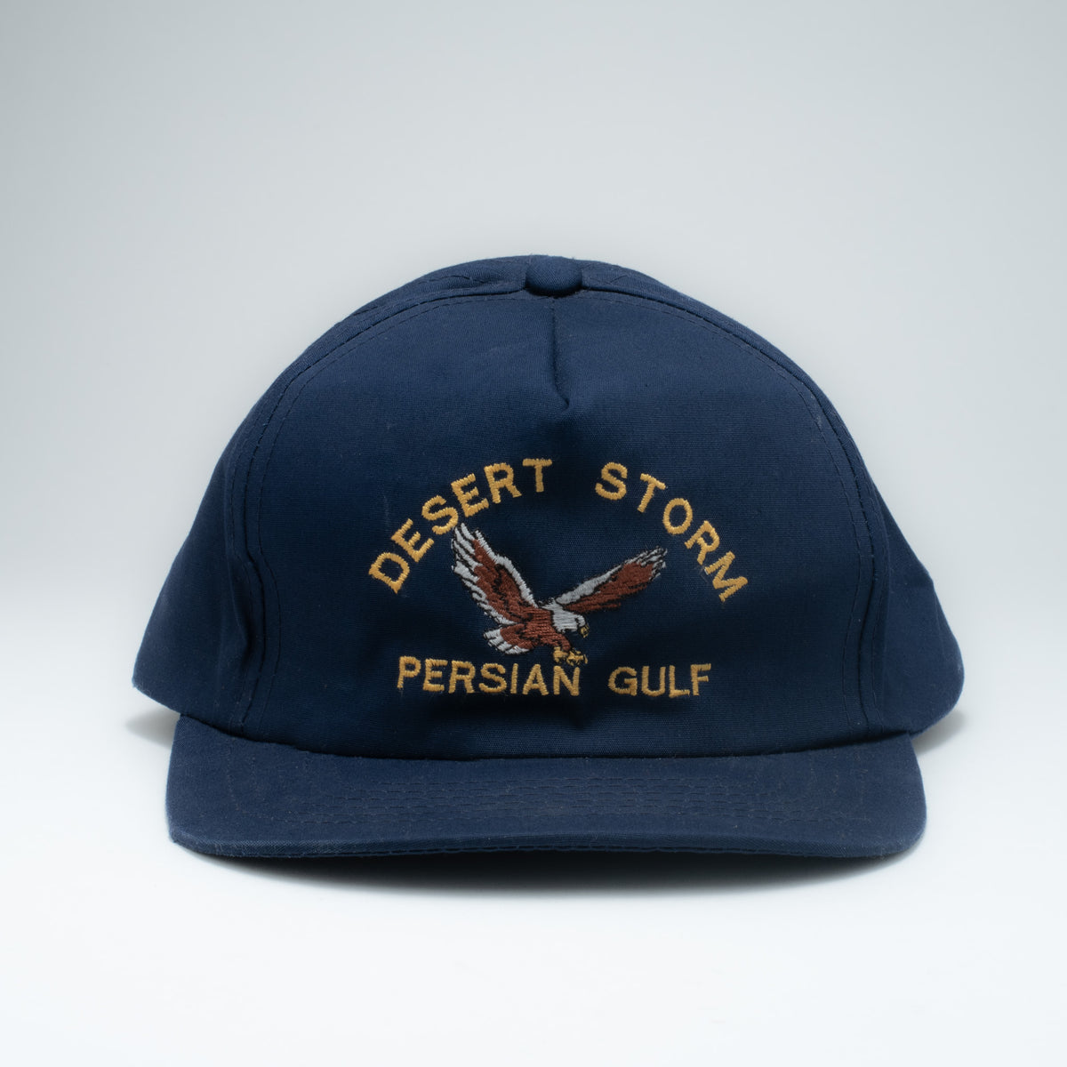 Vintage Desert Storm Persian Gulf snapback hat front view showing gold eagle embroidery