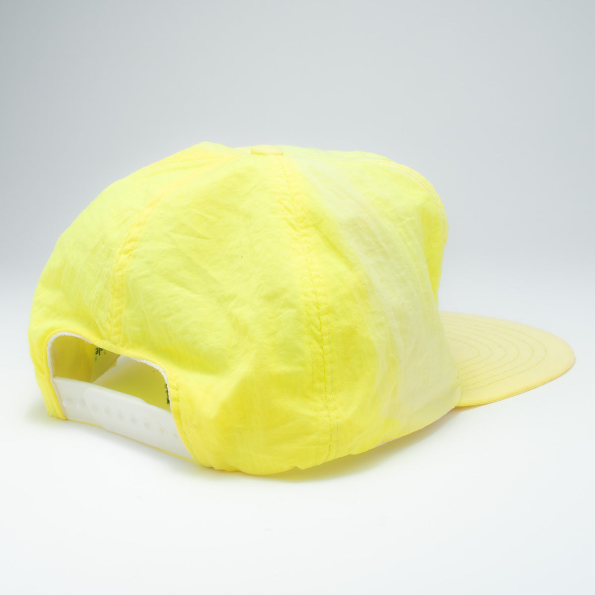 Vintage Alabama neon nylon snapback hat back view showing yellow plastic snapback closure