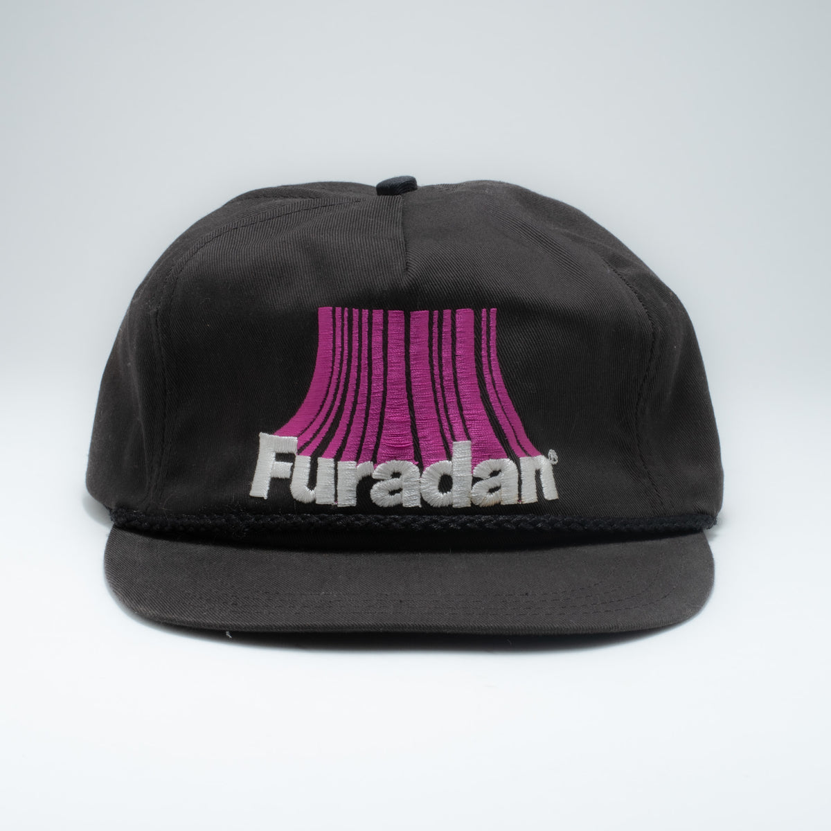 Vintage Furadan 5-panel strapback hat front view showing purple and white embroidered logo