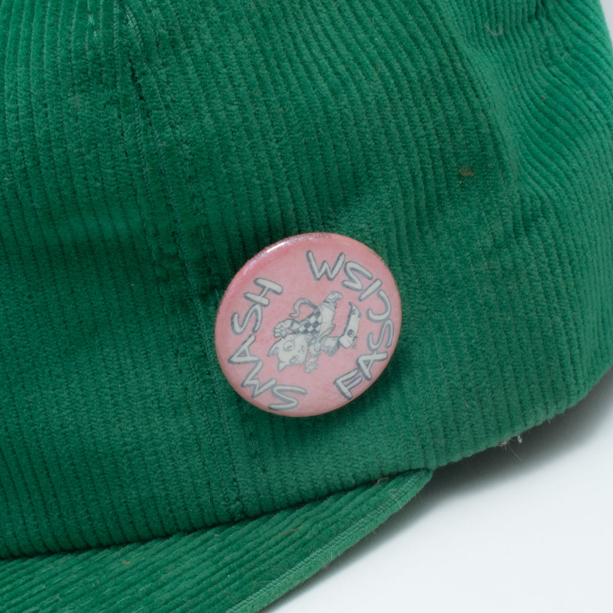 Vintage green corduroy snapback hat pink Wash Fast racing pin close up
