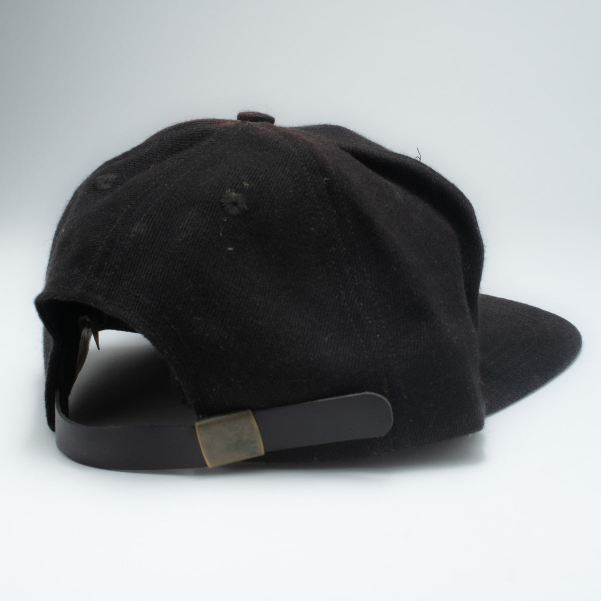 Vintage Marlboro 5-panel strapback cap back view showing dark brown leather strap with brass hardware