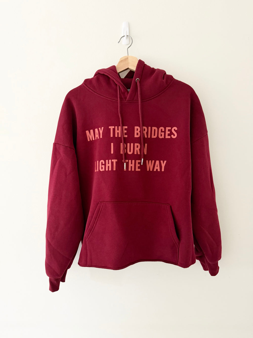 Vetements May The Bridges I Burn Light The Way hoodie front view in deep burgundy
