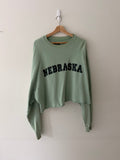 Raf Simons Nebraska crewneck full view on hanger showing mint green cropped silhouette