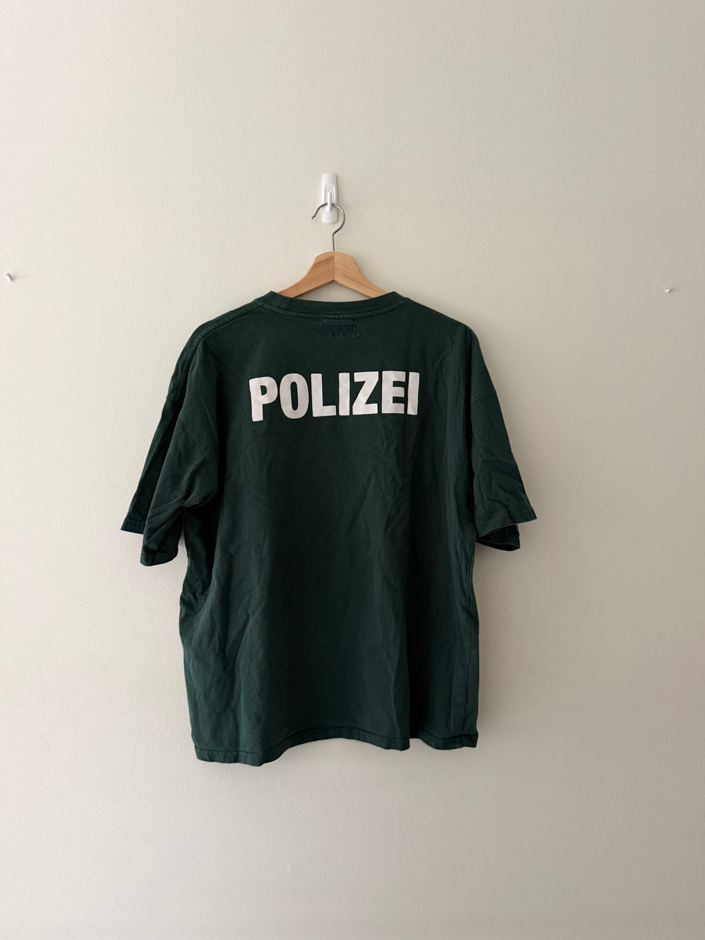 Vetements Polizei tee back view showing bold oversized POLIZEI print across full back