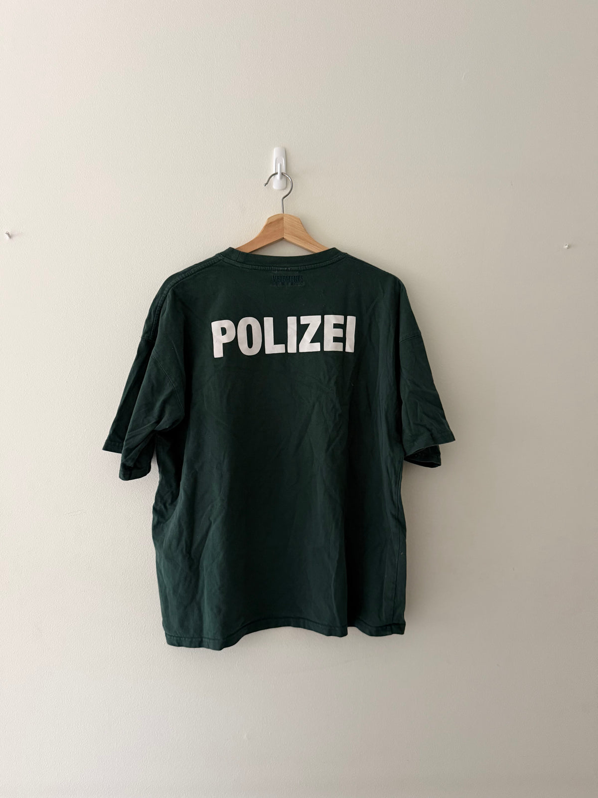 Vetements Polizei tee back view showing bold oversized POLIZEI print across full back