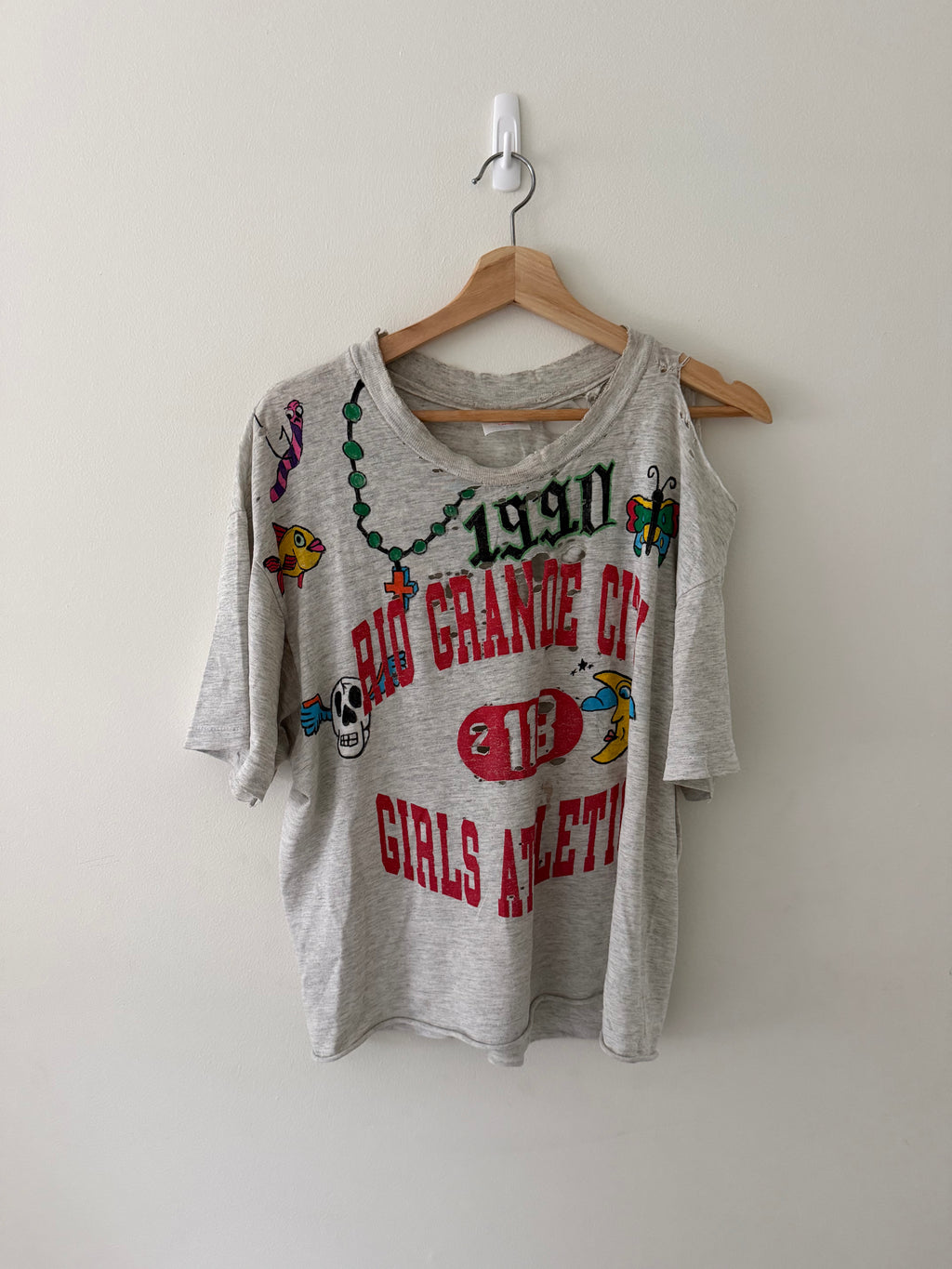 Elephant Man Original hand-drawn Champion tee full view showing 1990 Rio Grande City Girls Athletics print with multicolor illustrations