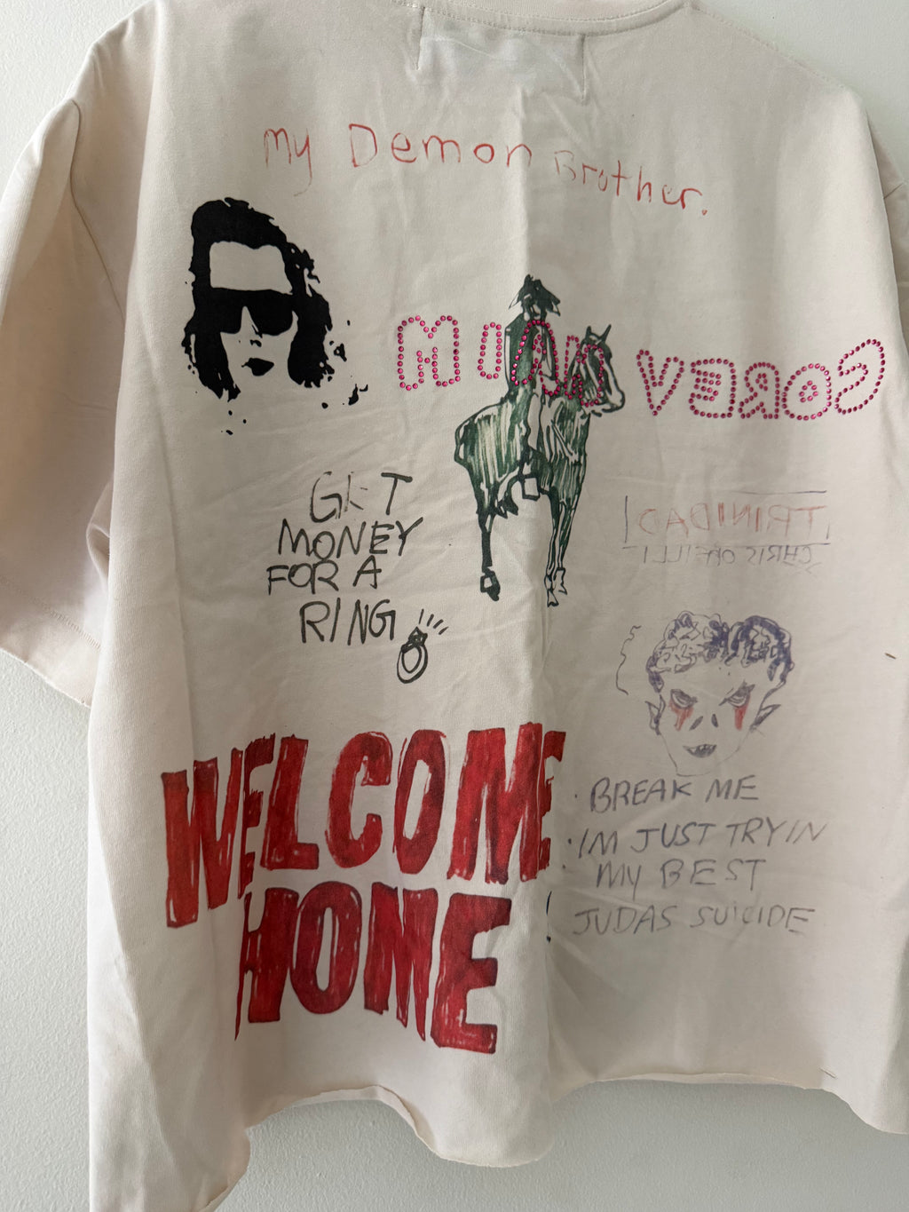 Paly Hollywood bedazzled tee back graphic close up showing MINA VEROC rhinestones horse rider and handwritten text details