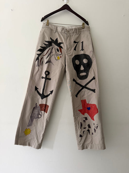 Elephant Man Original hand-drawn khaki trousers front view showing horse skull anchor Texas revolver and sun illustrations