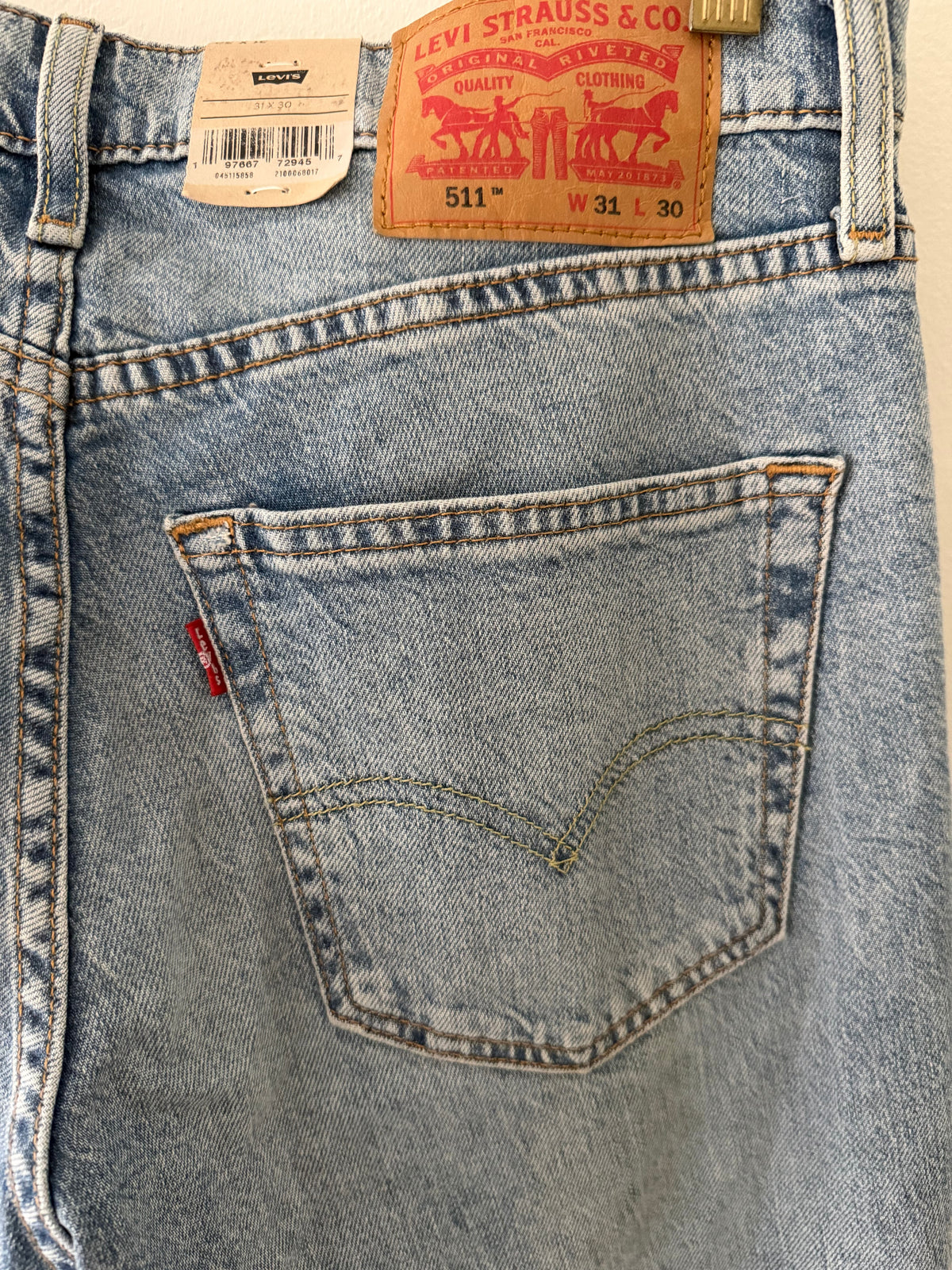 Vintage Levi's 511 back close up showing leather patch W31 L30 red tab and original hang tag