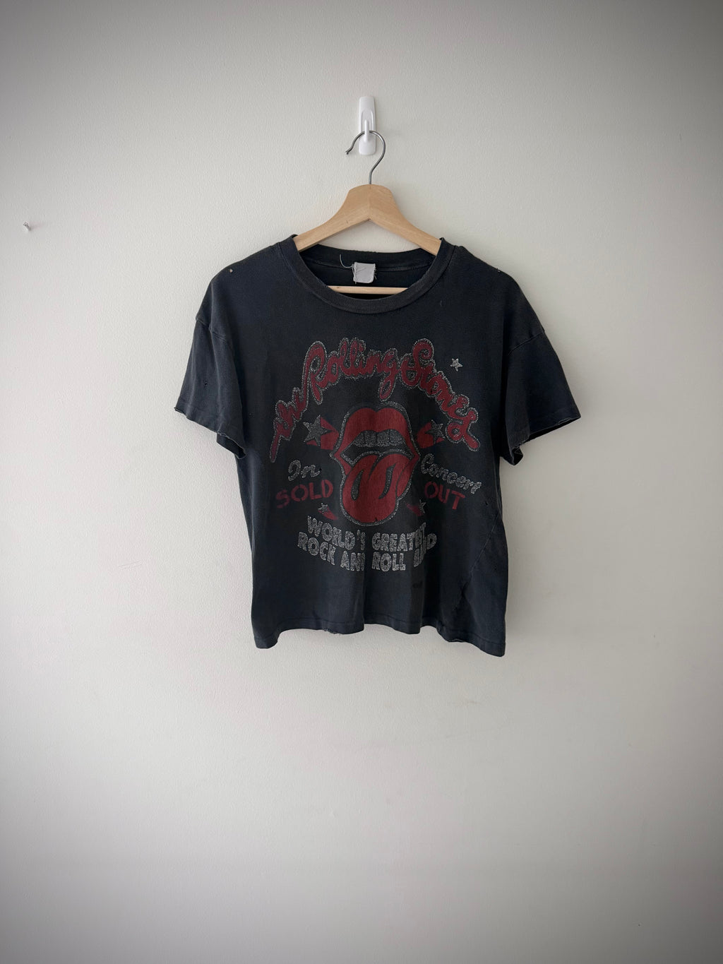 Close-up of Rolling Stones tongue logo graphic on t-shirt