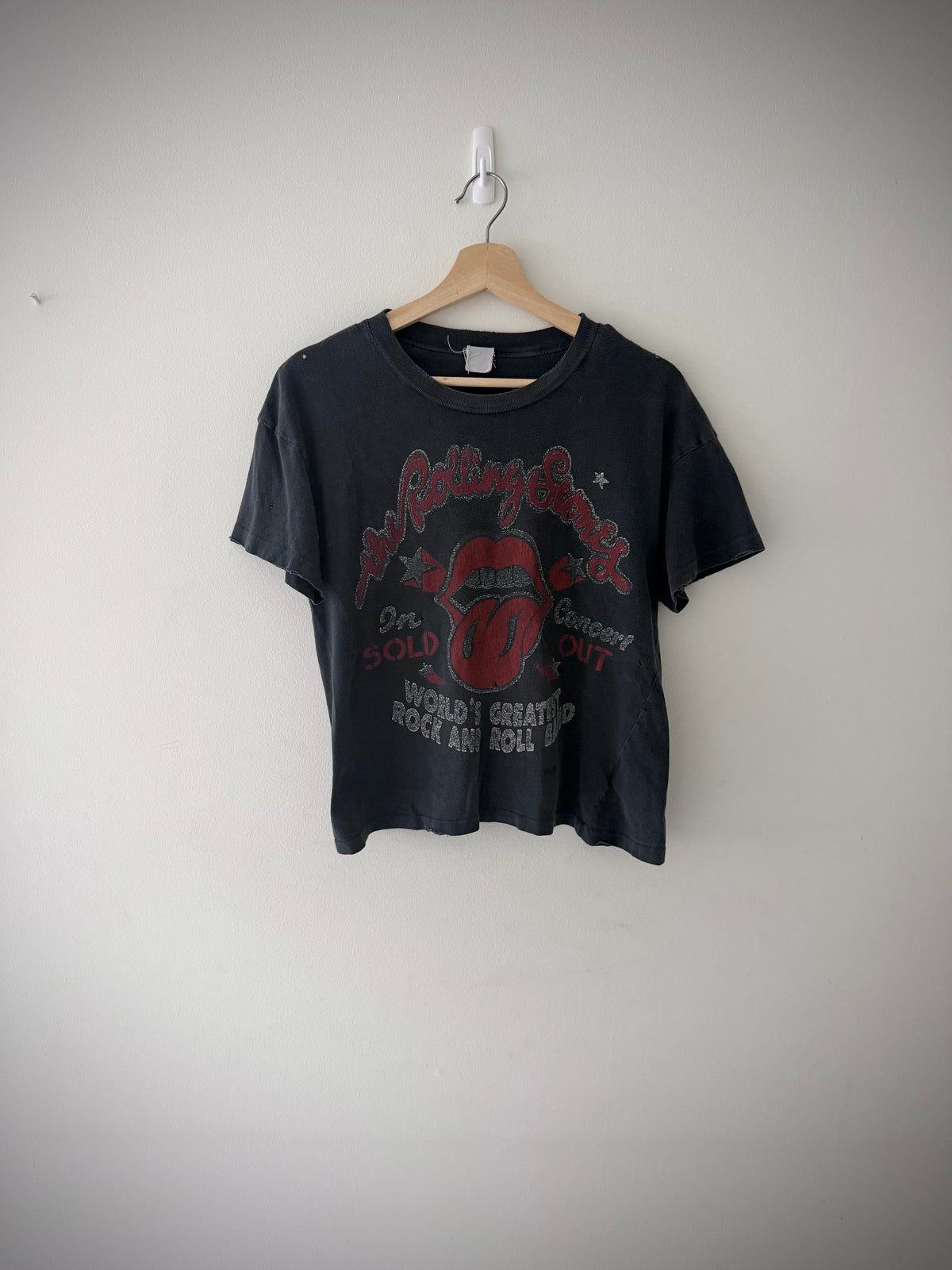 Close-up of Rolling Stones tongue logo graphic on t-shirt