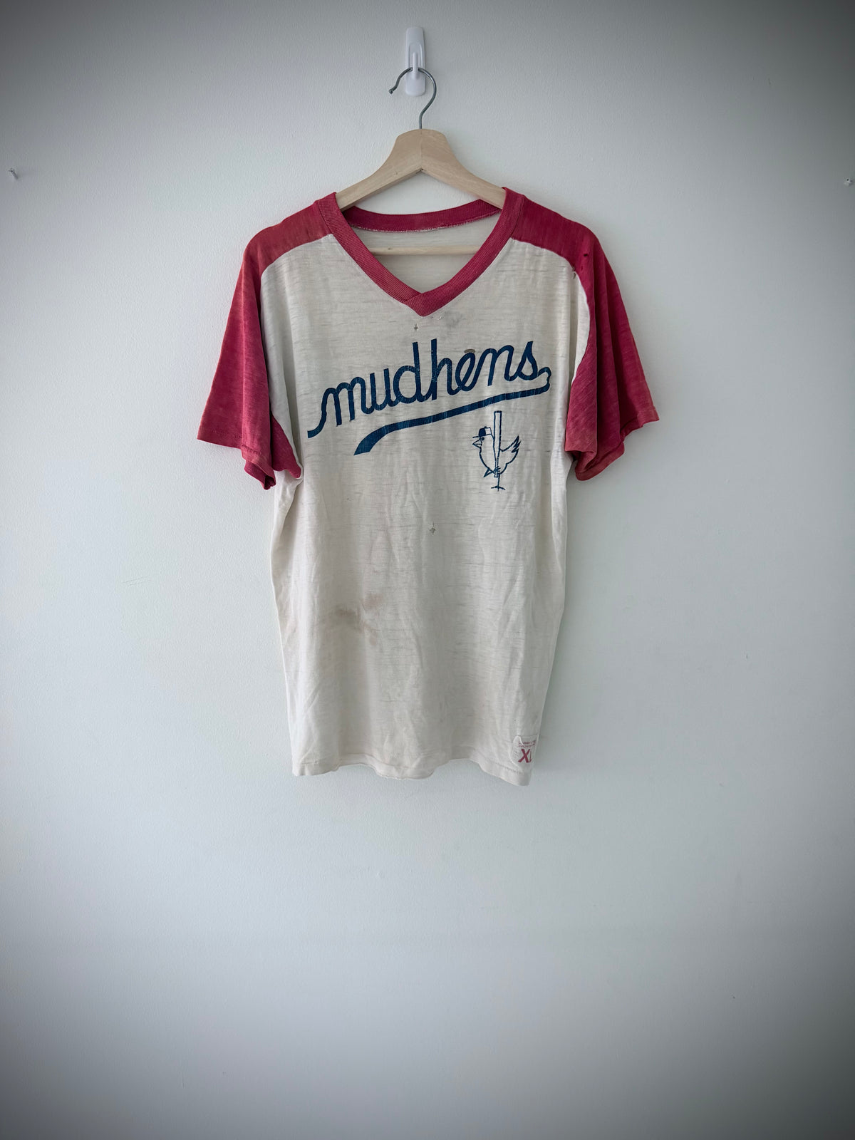 Larry Lowe Sportswear XL size tag on Mudhens jersey