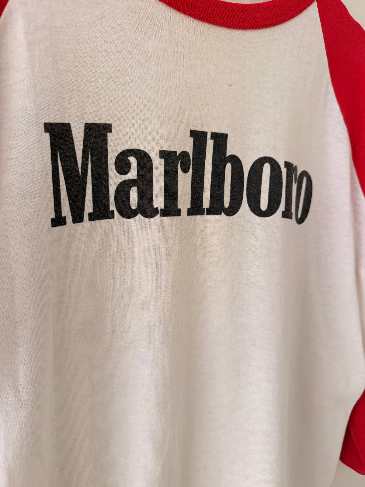 Close-up of Marlboro logo on raglan t-shirt