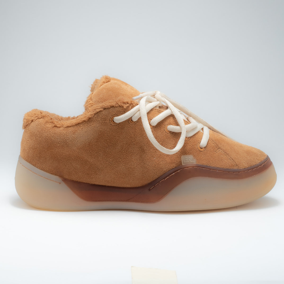 ERL Vamp sneaker side profile view showing translucent gum sole and brown midsole