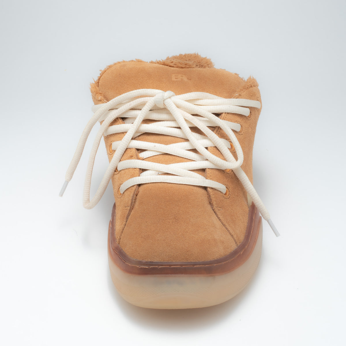 ERL Vamp sneaker front toe view showing cream oval laces and shearling trim